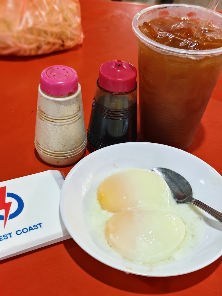 Soft-boiled eggs and teh O peng at Seng Kee