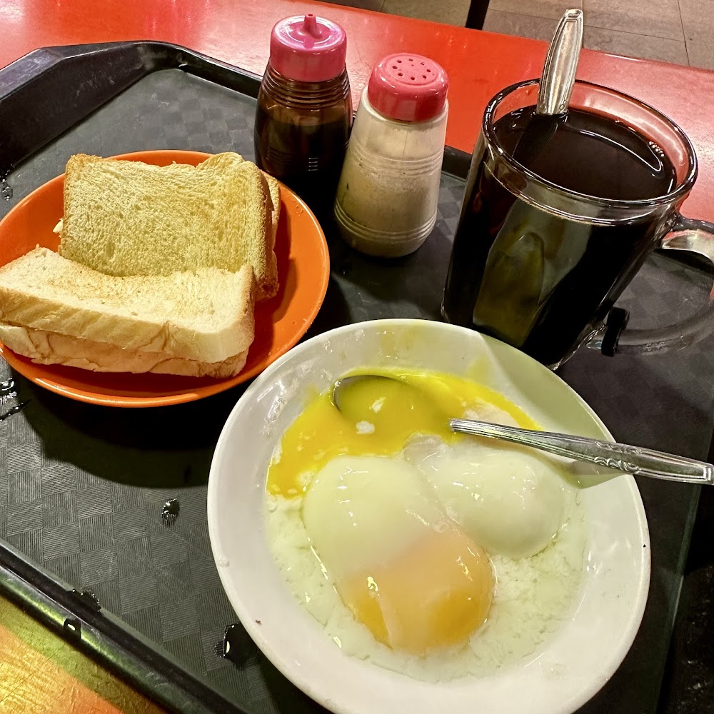 Silky soft-boiled eggs with dark soy and white pepper at Seng Kee